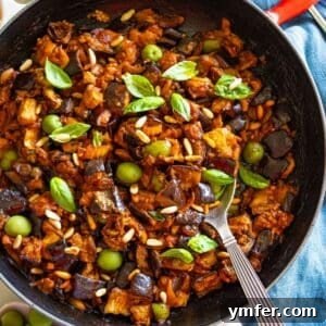 Wholesome Eggplant Caponata 11 Authentic Sicilian caponata recipe styled in a skillet with a spoon, perfect as a Mediterranean side or plant-based appetizer.