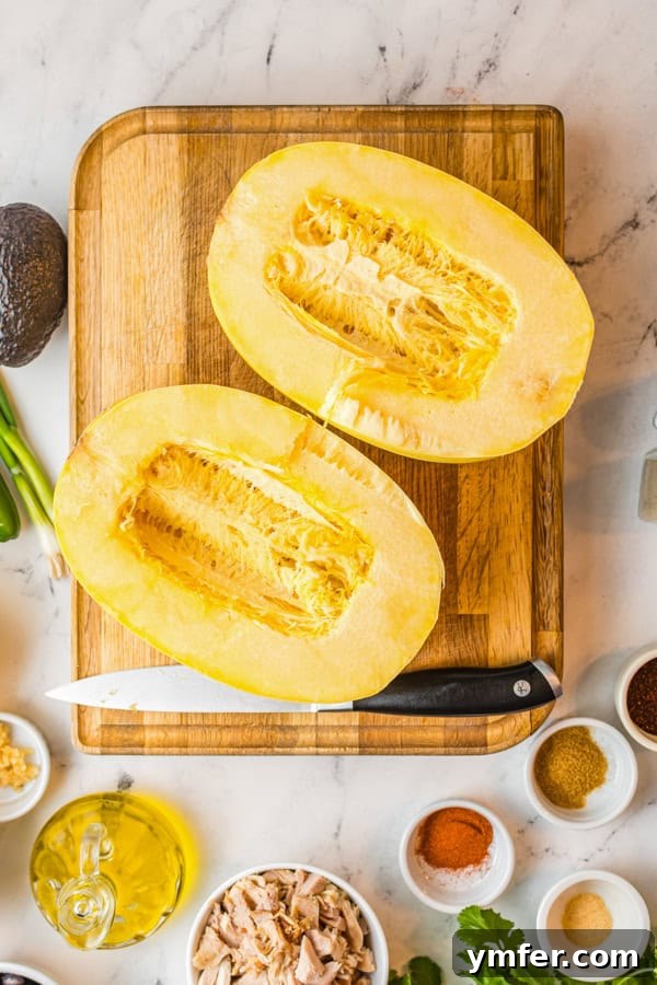 Zesty Southwestern Air Fryer Spaghetti Squash 3 Ingredients laid out for Air Fryer Southwest Spaghetti Squash, including fresh vegetables, spices, and chicken.