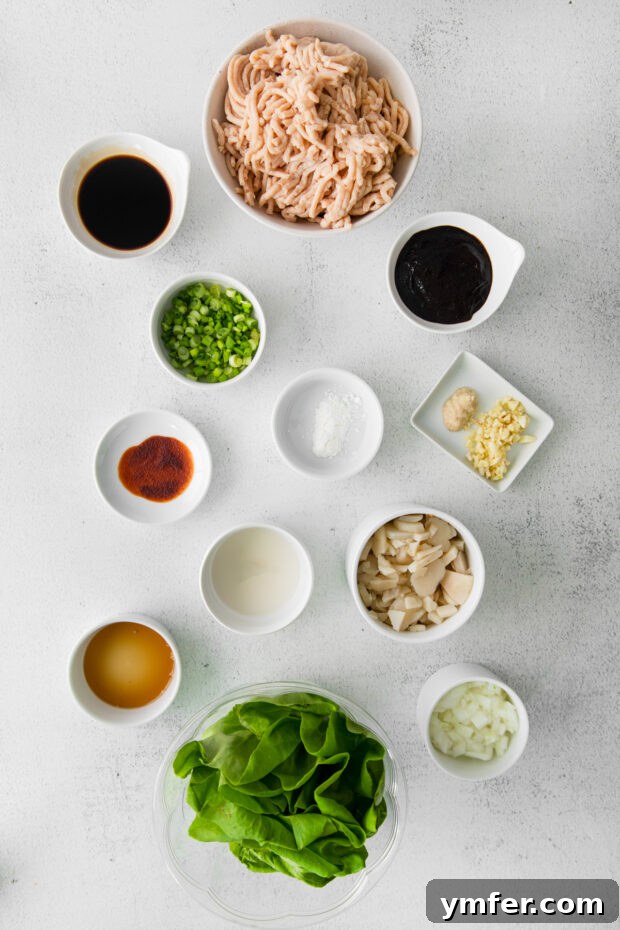 Savory Chicken Lettuce Cups 3 Ingredients laid out on a cutting board, ready to make copycat P.F. Chang's Chicken Lettuce Wraps.