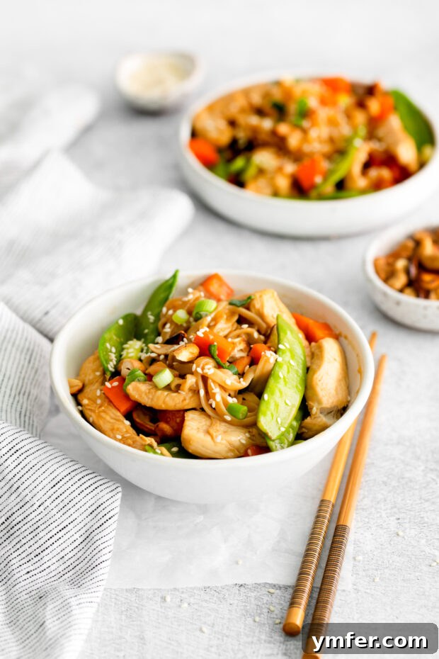 Savory Cashew Chicken Pad Thai 8 Cashew Chicken Pad Thai sprinkled with sesame seeds.