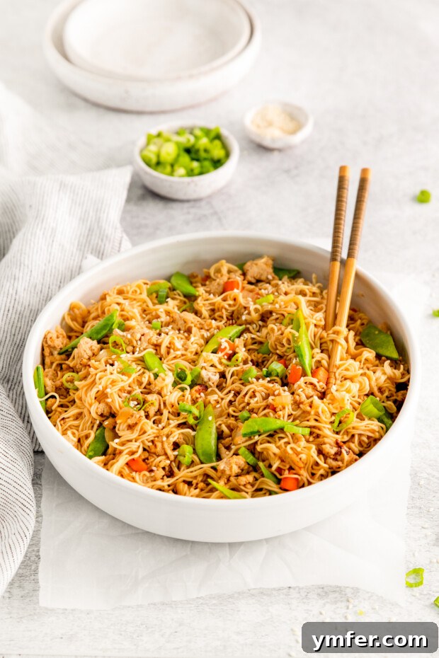 Umami Chicken Ramen Stir Fry 7 Ground Chicken Ramen Stir Fry topped with sesame seeds.