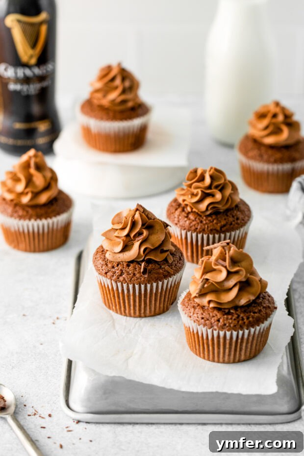 Velvet Stout Chocolate Cupcakes 7 Close-up of freshly baked Chocolate Guinness Cupcakes generously topped with swirled chocolate frosting.