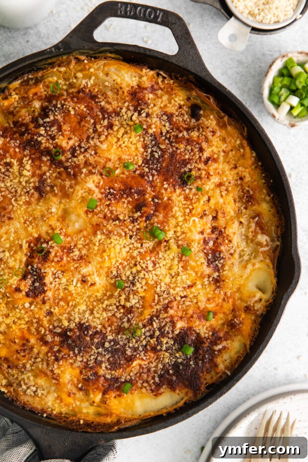 Ultimate Homemade Scalloped Potatoes 10 Homemade Scalloped Potatoes in a skillet, garnished with chopped green onions for a pop of color.