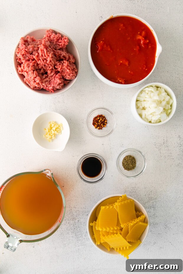 Easy Instant Pot Lasagna Soup 3 Ingredients for Instant Pot Lasagna Soup laid out on a wooden table.