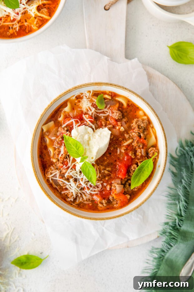 Easy Instant Pot Lasagna Soup 10 Instant Pot Lasagna Soup topped with a dollop of creamy ricotta cheese.