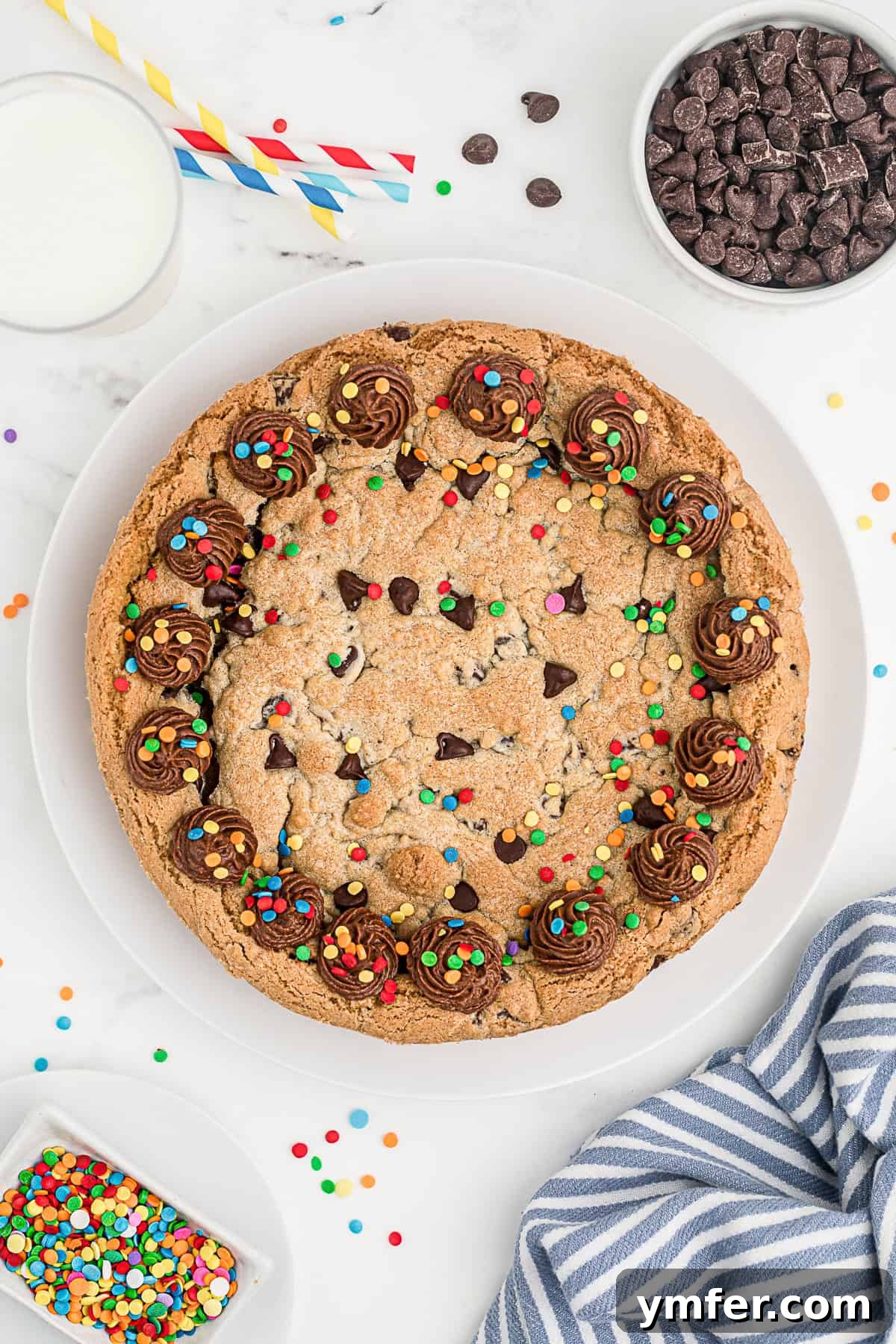 Ultimate Chocolate Chip Cookie Cake 2 A beautifully decorated Chocolate Chip Cookie Cake covered in vibrant sprinkles, ready for a party.