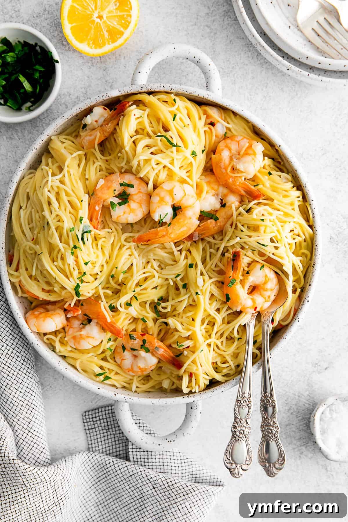 Effortless Instant Pot Shrimp Scampi 2 Instant Pot Shrimp Scampi in a bowl with a serving spoon.