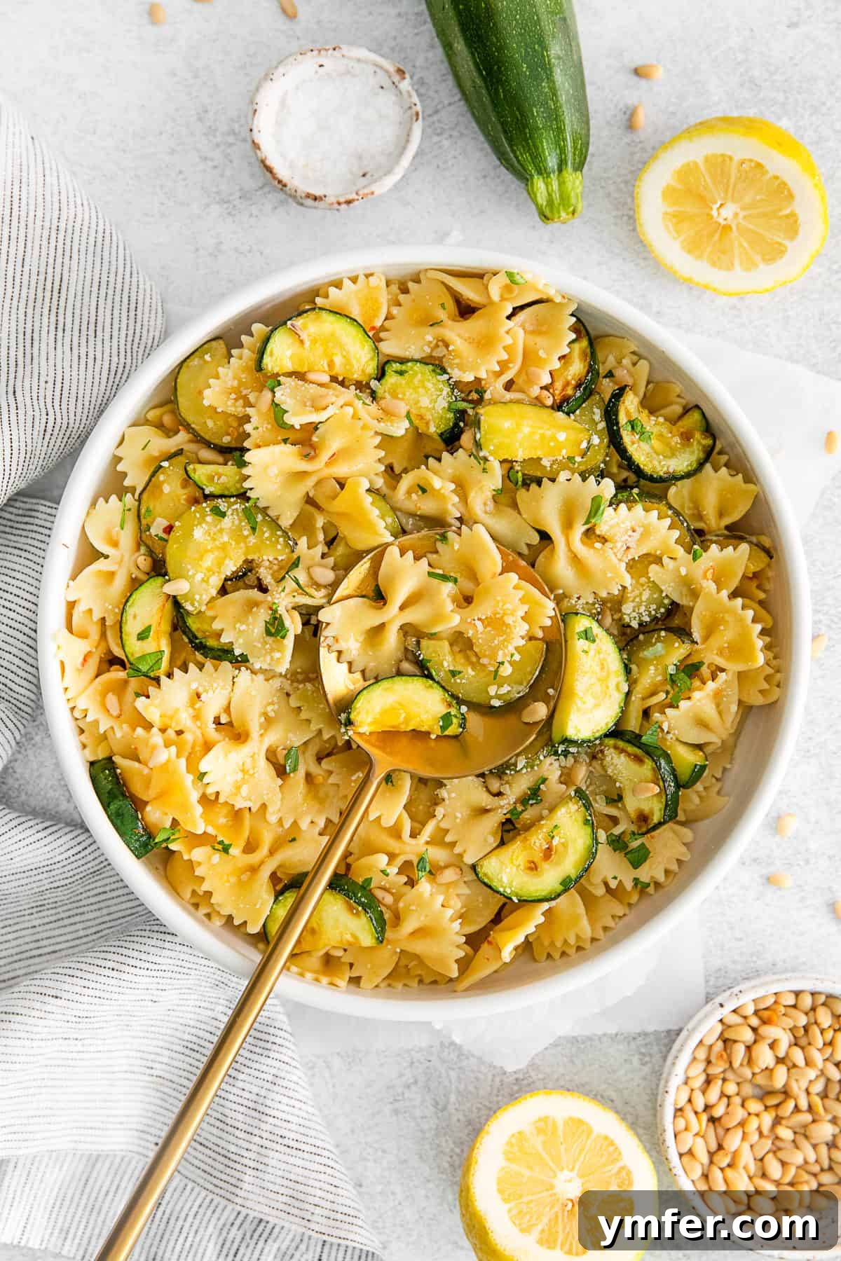 Bright Lemon Zucchini Pasta 2 A vibrant bowl of Lemon Zucchini Pasta with bowtie noodles, showcasing fresh zucchini, garlic, and a hint of lemon.
