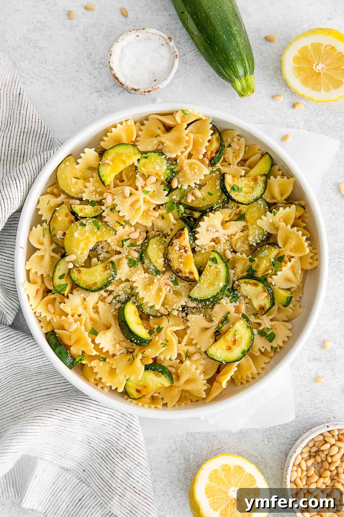 Bright Lemon Zucchini Pasta 9 A delicious serving of Lemon Zucchini Pasta, finished with a generous sprinkle of grated Parmesan cheese.