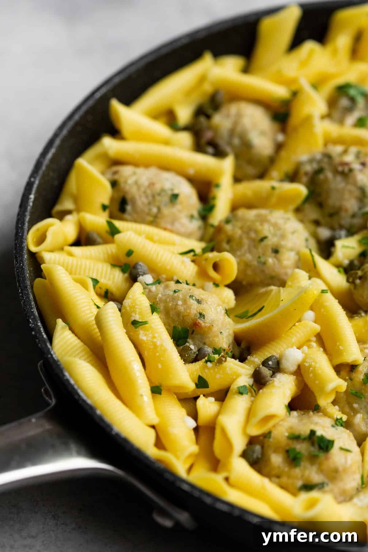 Tangy Lemon Caper Chicken Meatballs 6 Container of leftover chicken piccata meatballs.