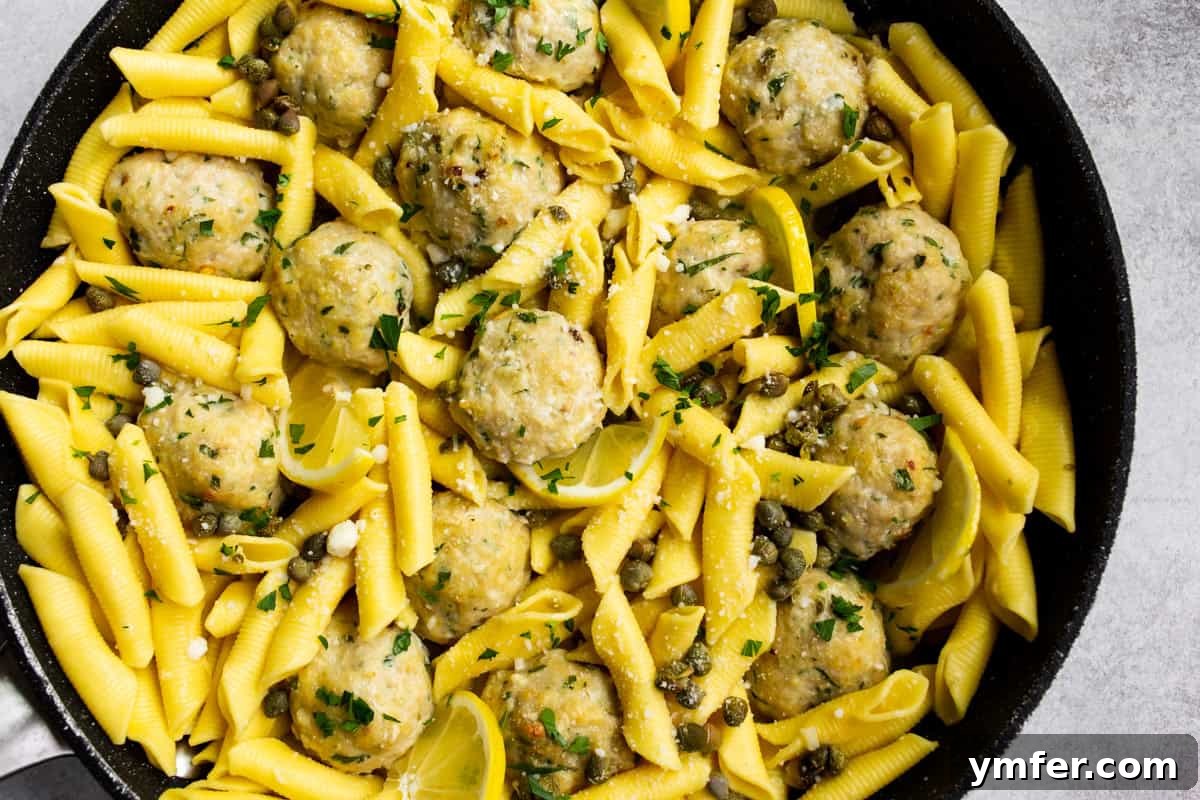 Tangy Lemon Caper Chicken Meatballs 7 Serving of chicken piccata meatballs with pasta.
