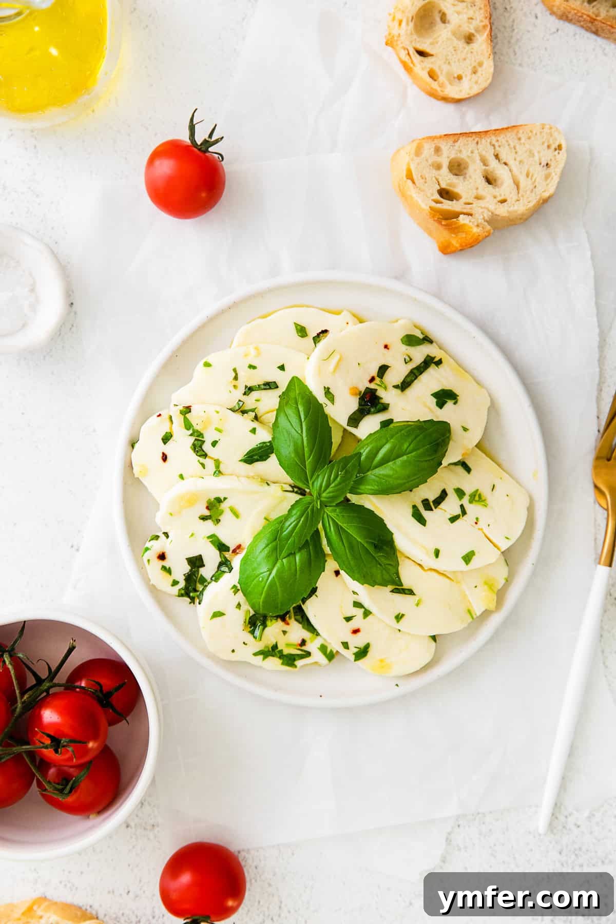 Flavorful Mozzarella Delights 6 Marinated Mozzarella on a white plate.