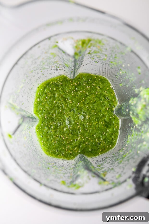Vibrant Homemade Salsa Verde 5 Blended Homemade Salsa Verde in a blender container.