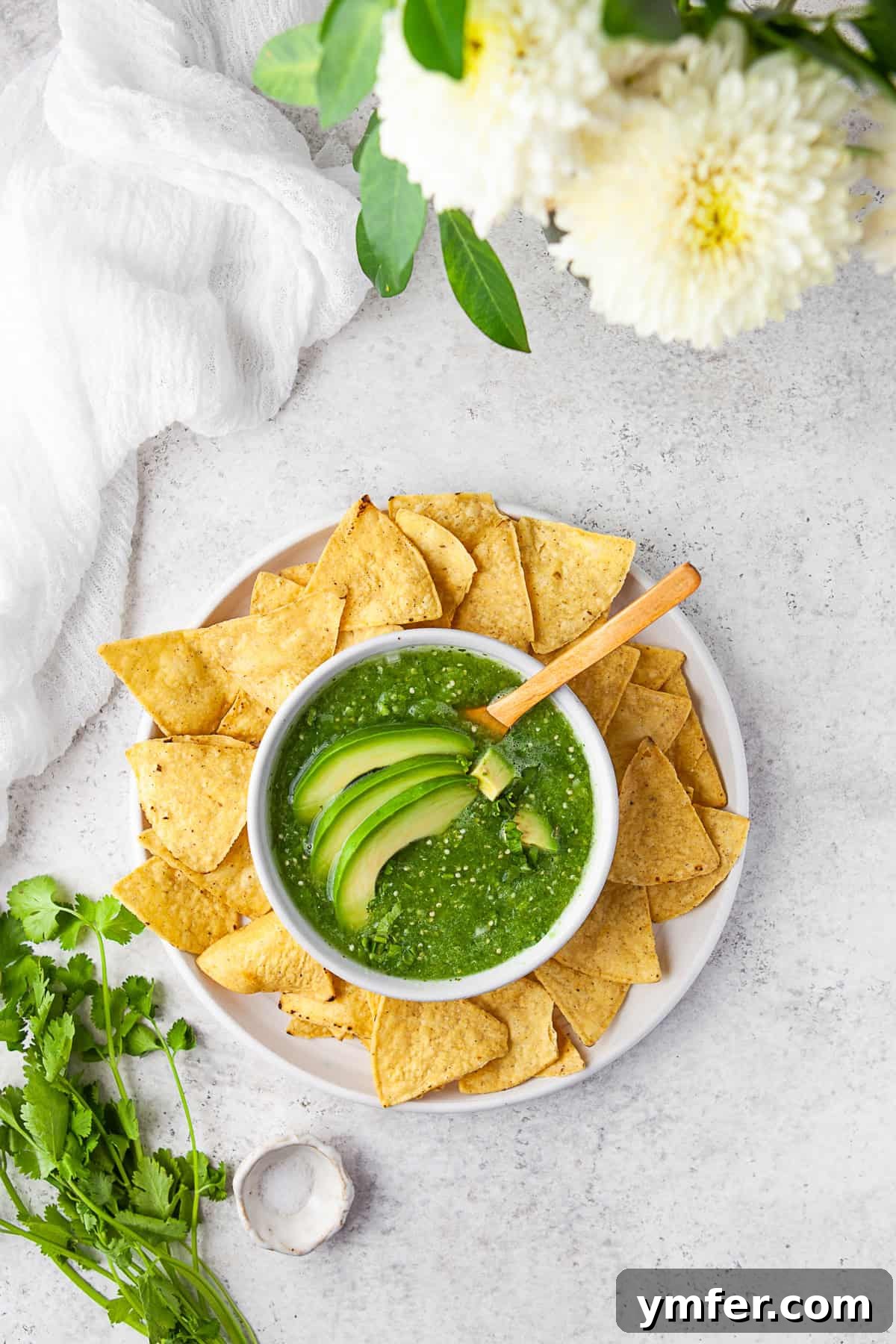 Vibrant Homemade Salsa Verde 6 Homemade Salsa Verde served with avocado on top.