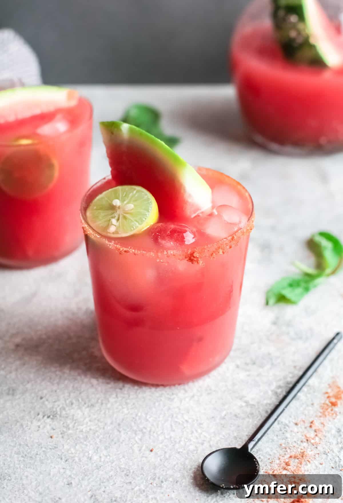 Blush Paloma 2 Watermelon Paloma in a glass with a lime wedge.