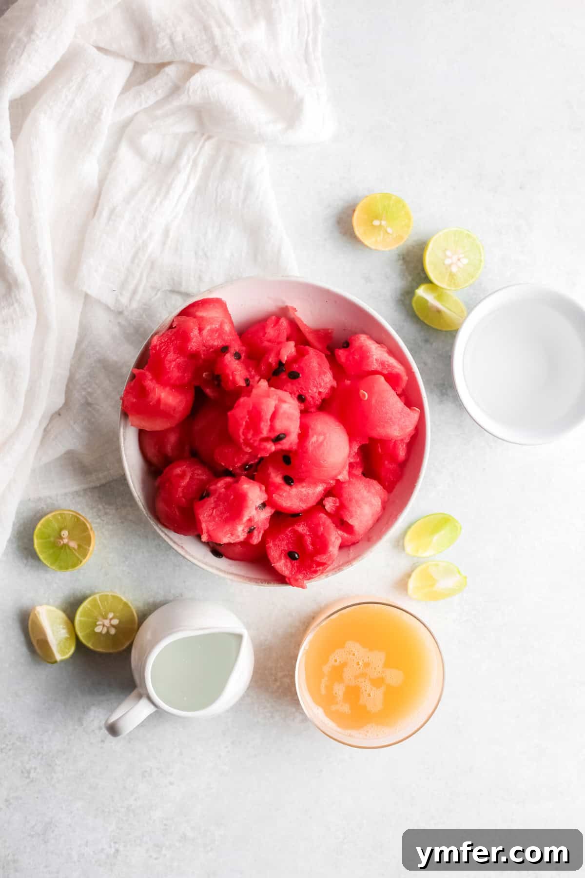 Blush Paloma 3 Ingredients to make a watermelon Paloma sitting on a table.
