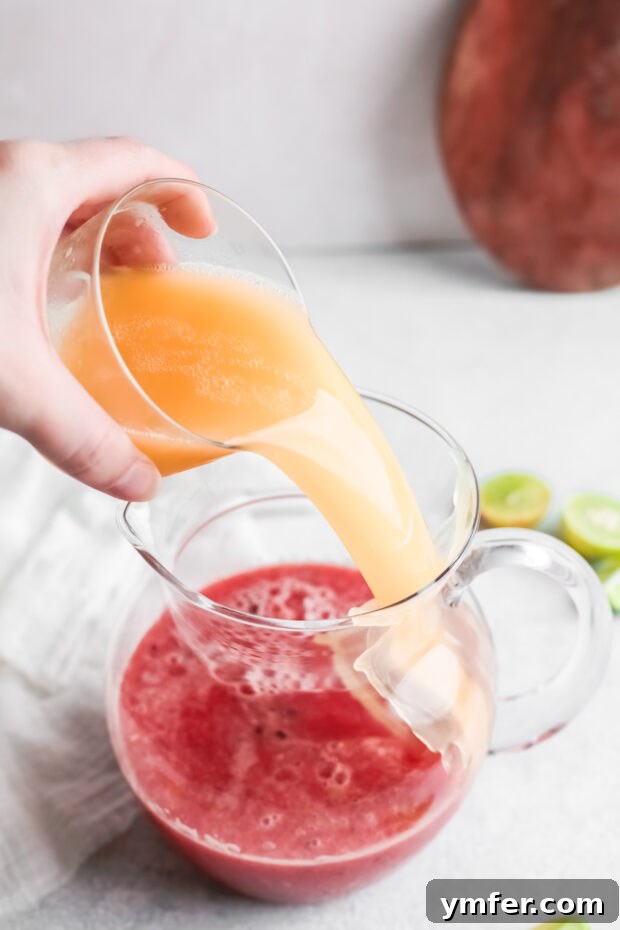 Blush Paloma 5 Pouring grapefruit juice into blended watermelon.