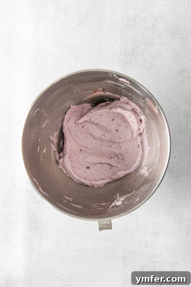 Blackberry Bramble Cupcakes 6 Smooth and creamy blackberry frosting in a stand mixer bowl, ready for piping.