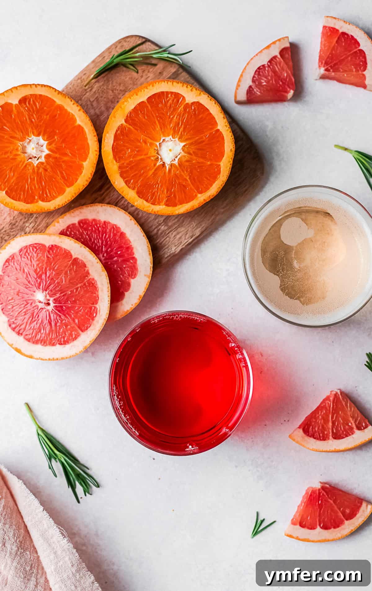 Slushy Aperol Bliss 3 Aperol, champagne, and fresh fruit slices on a table.