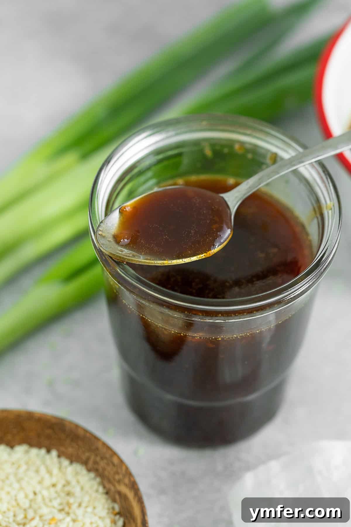 Simple Homemade Teriyaki 2 Homemade Teriyaki Sauce on a spoon, showcasing its rich, glossy texture.
