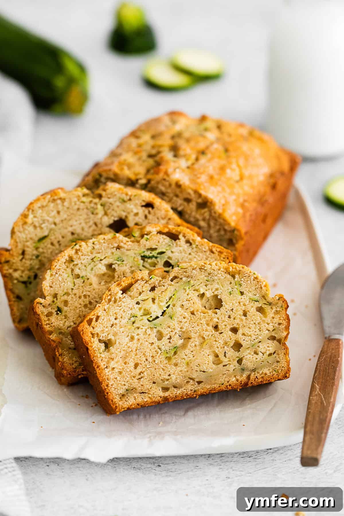 Zucchini Bread sliced on a serving platter. 
