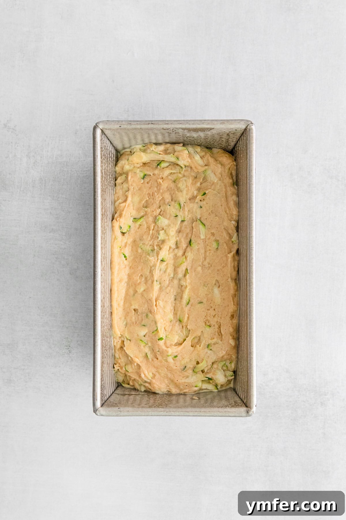 Uncooked Zucchini Bread in a pan. 