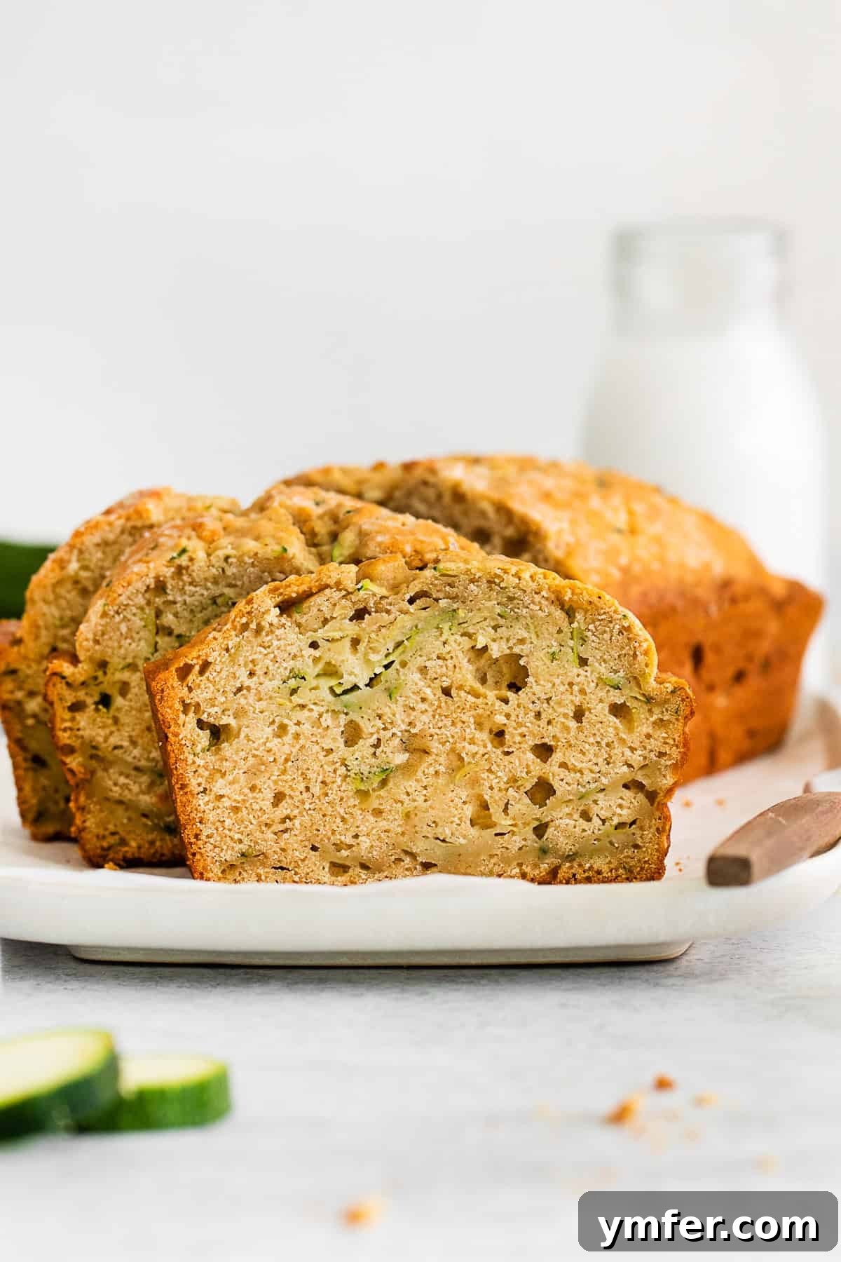 A slice of Zucchini Bread on a plate. 