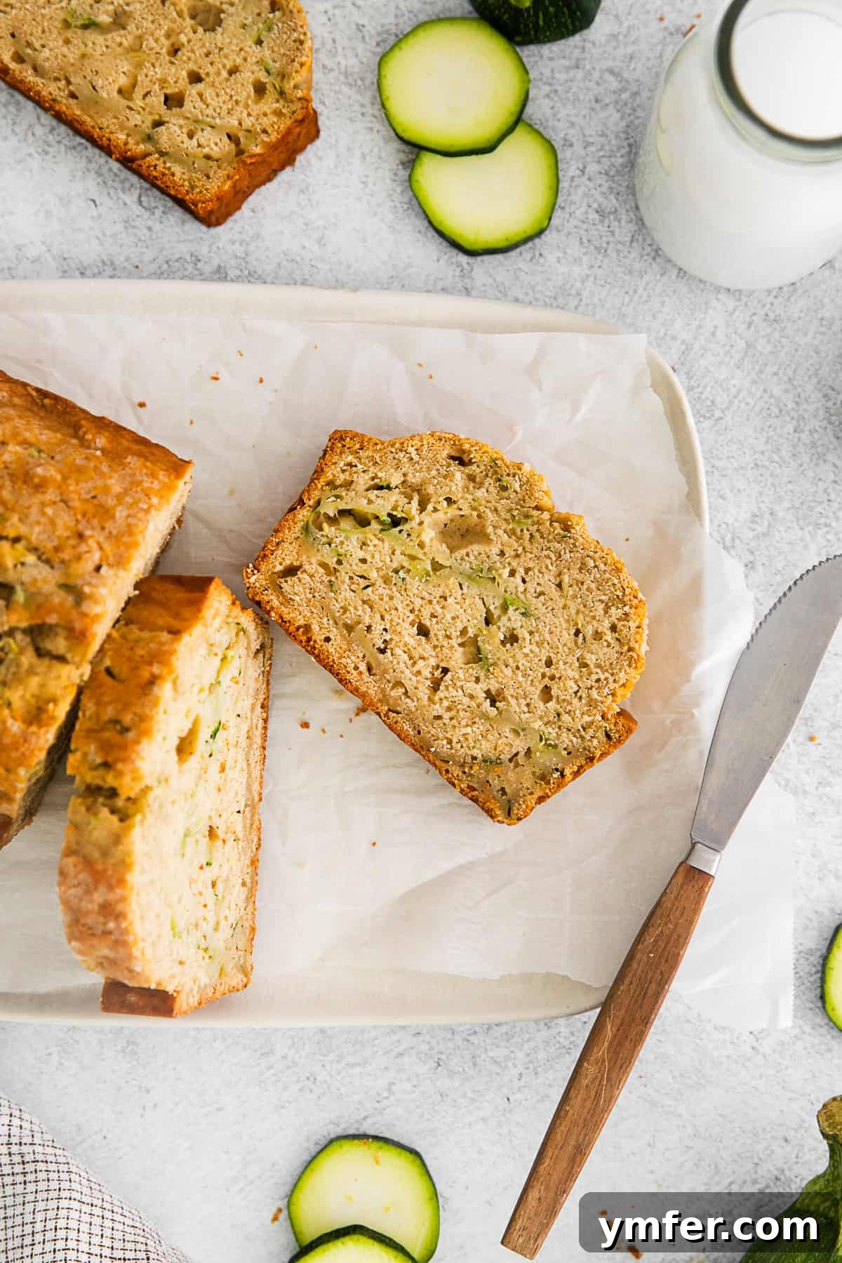 Zucchini Bread sitting on parchment paper. 