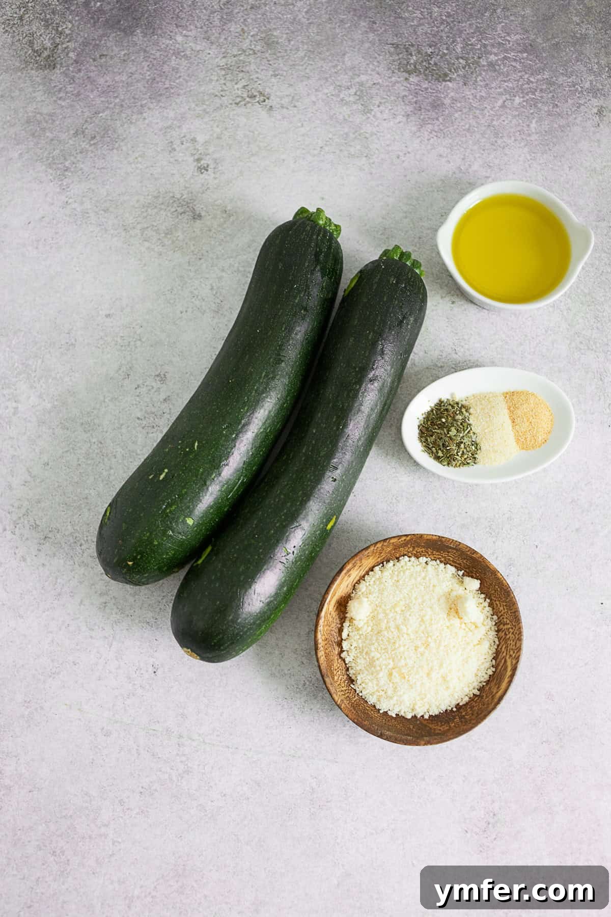 Fire-Kissed Zucchini 3 A selection of fresh ingredients laid out on a table, ready to make grilled zucchini.