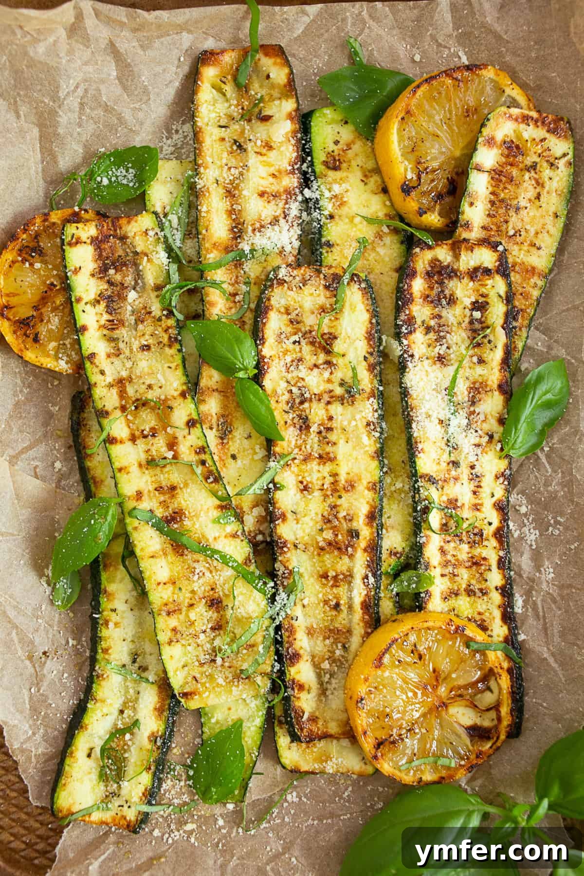 Fire-Kissed Zucchini 6 Grilled Zucchini garnished with fresh basil leaves, ready to serve.