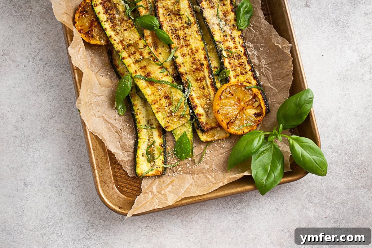 Fire-Kissed Zucchini 9 Grilled Zucchini artfully arranged on a sheet pan, ready for serving.