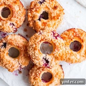 Finished Baked Blueberry Streusel Donuts on a white platter.