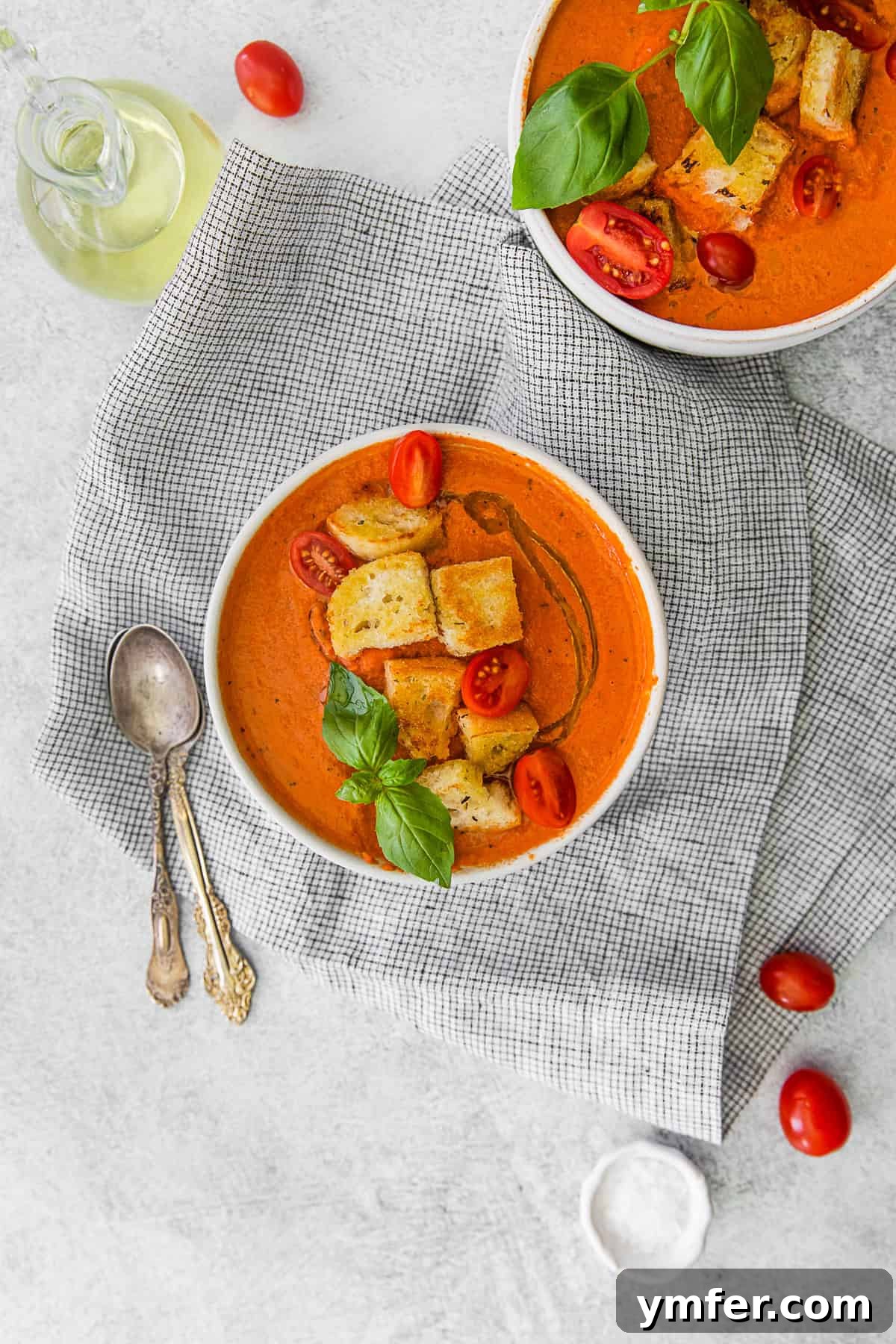 Effortless Instant Pot Tomato Delight 9 Instant Pot Tomato Soup in a white bowl. A pristine white bowl filled with rich, creamy Instant Pot Tomato Soup, set against a simple backdrop.