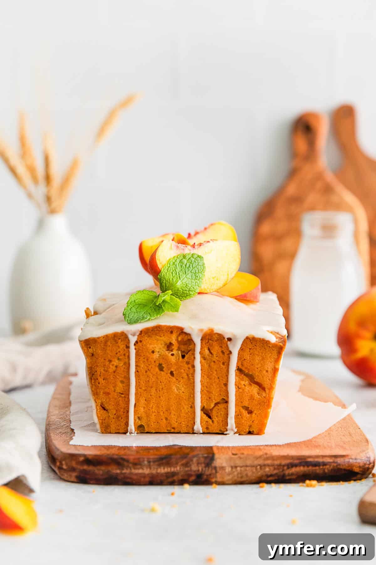 Sun-Kissed Peach Pound Cake 9 Peach Pound Cake topped with glaze.