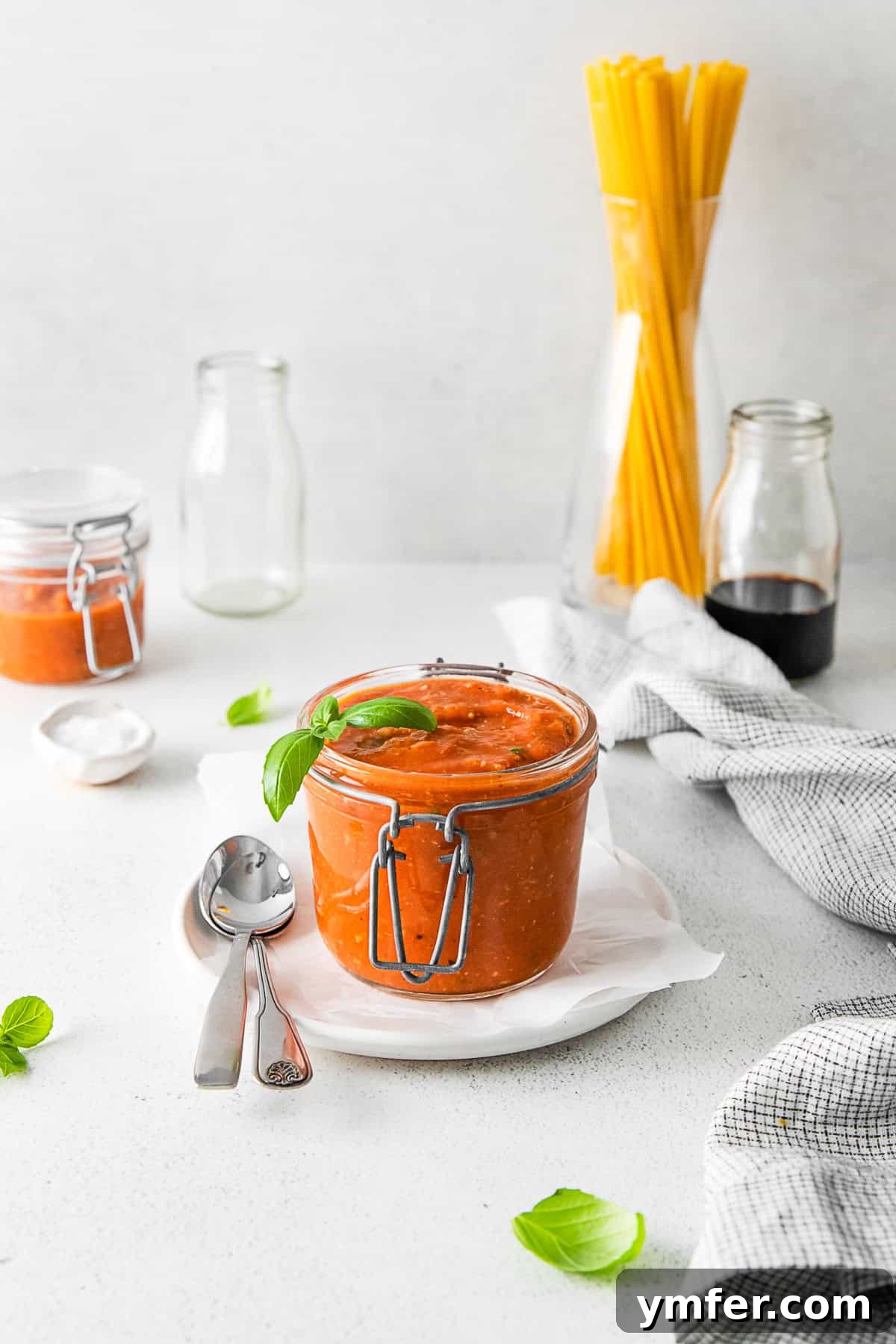 Richly Roasted Tomato Sauce 9 A glass jar filled with rich, vibrant Roasted Tomato Sauce, showcasing its appealing color and smooth texture.
