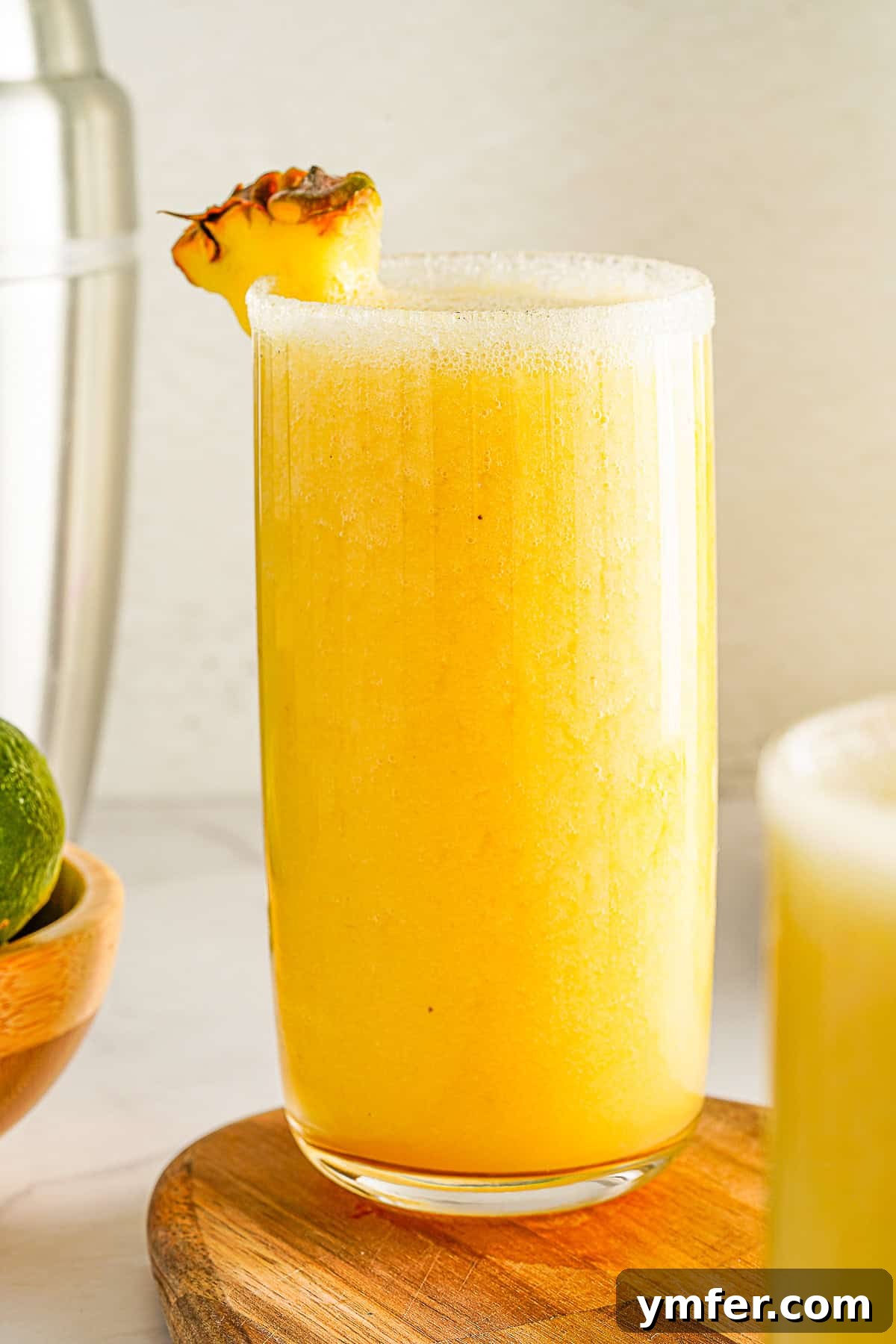 Tropical Mango Pineapple Bliss 7 Mango Pineapple Smoothie served in a tall glass, ready to be enjoyed.
