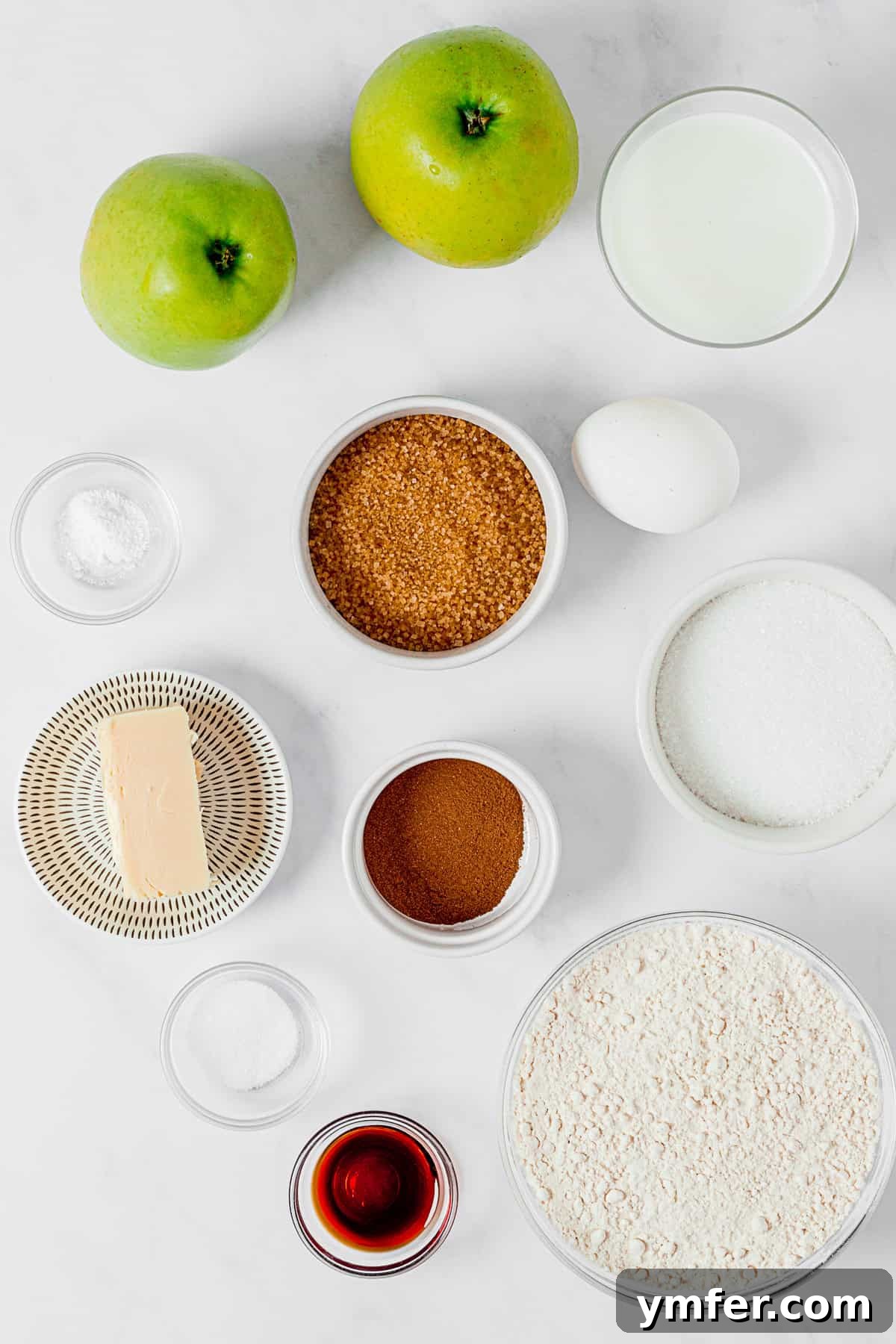 Spiced Apple Streusel Loaf 3 Ingredients for Apple Streusel Bread laid out on a table, including flour, apples, butter, and cinnamon.