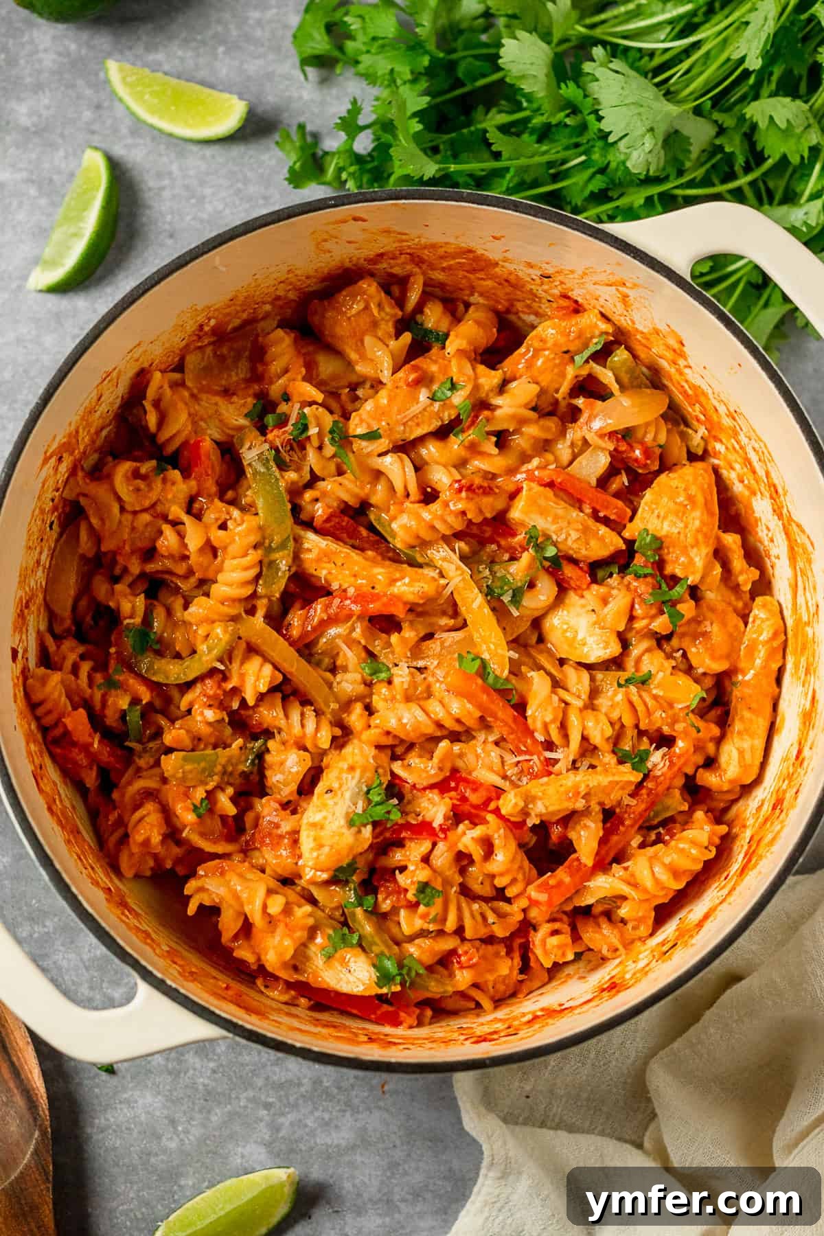 Zesty Skillet Chicken Fajita Pasta 2 One Pot Chicken Fajita Pasta in a large pot for cooking, showcasing a vibrant mix of chicken, pasta, and vegetables.