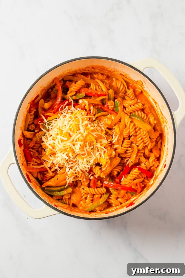Zesty Skillet Chicken Fajita Pasta 5 One Pot Chicken Fajita Pasta topped with melted cheese and fresh cilantro.