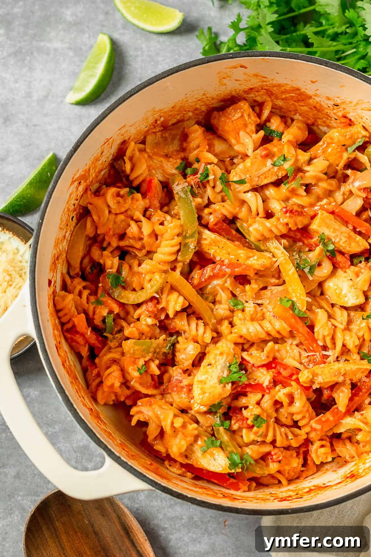 Zesty Skillet Chicken Fajita Pasta 7 One Pot Chicken Fajita Pasta cooking in a large pot, with steam rising.