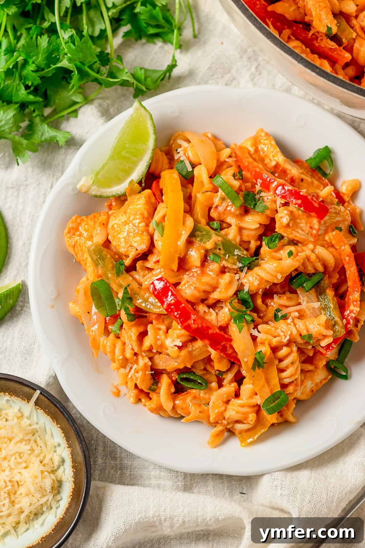 Zesty Skillet Chicken Fajita Pasta 8 One Pot Chicken Fajita Pasta served on a white plate, ready to eat.