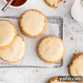 Close-up of a maple glazed cookie, featuring its golden hue and delicious glaze.