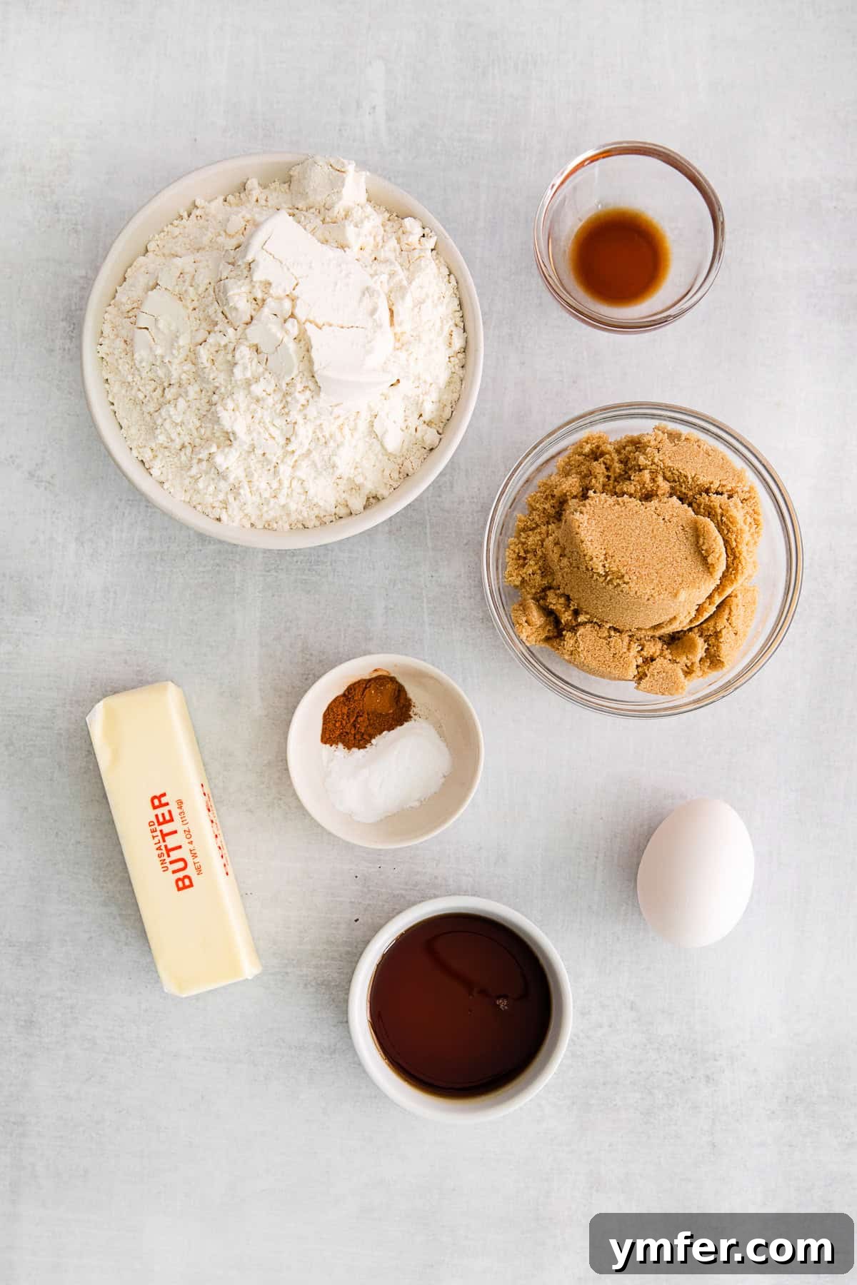 Maple Drizzle Delights 3 Assortment of ingredients laid out for making maple cookies, including butter, sugar, syrup, and flour.