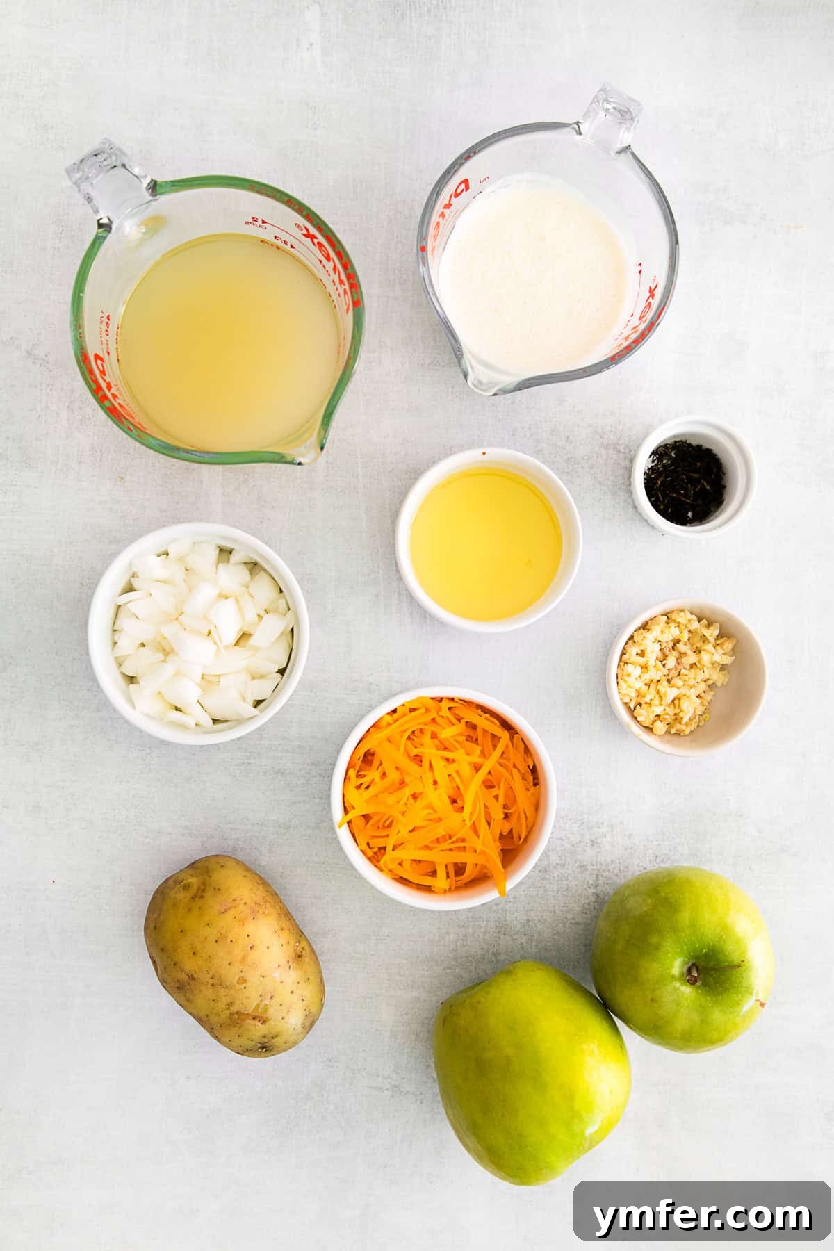 Creamy Cheddar Apple Harmony 3 Apple Cheddar Soup ingredients on a table.
