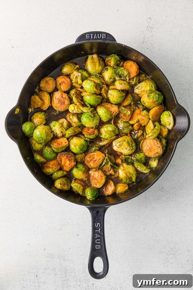 Kung Pao'd Brussels Sprouts 5 Kung Pao Brussels Sprouts in a cast iron skillet.