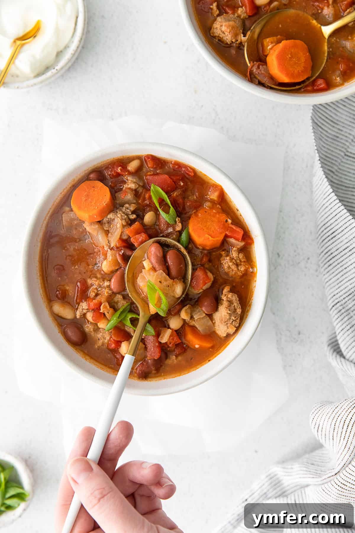 Hearty Instant Pot Turkey Chili 7 Bowls of chili beans, including red kidney beans and Great Northern beans, in a rustic setting.