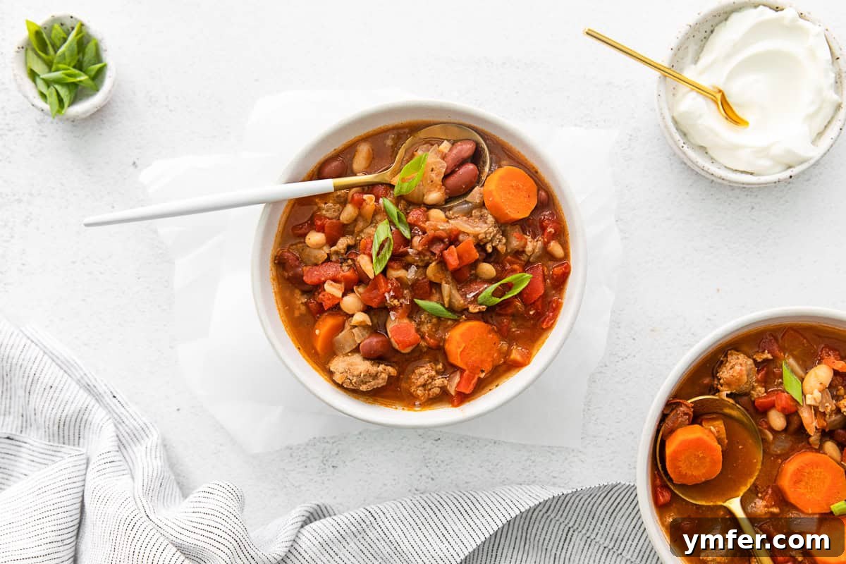 Hearty Instant Pot Turkey Chili 9 A top-down view of the Instant Pot Turkey Chili with garnishes and side dishes.
