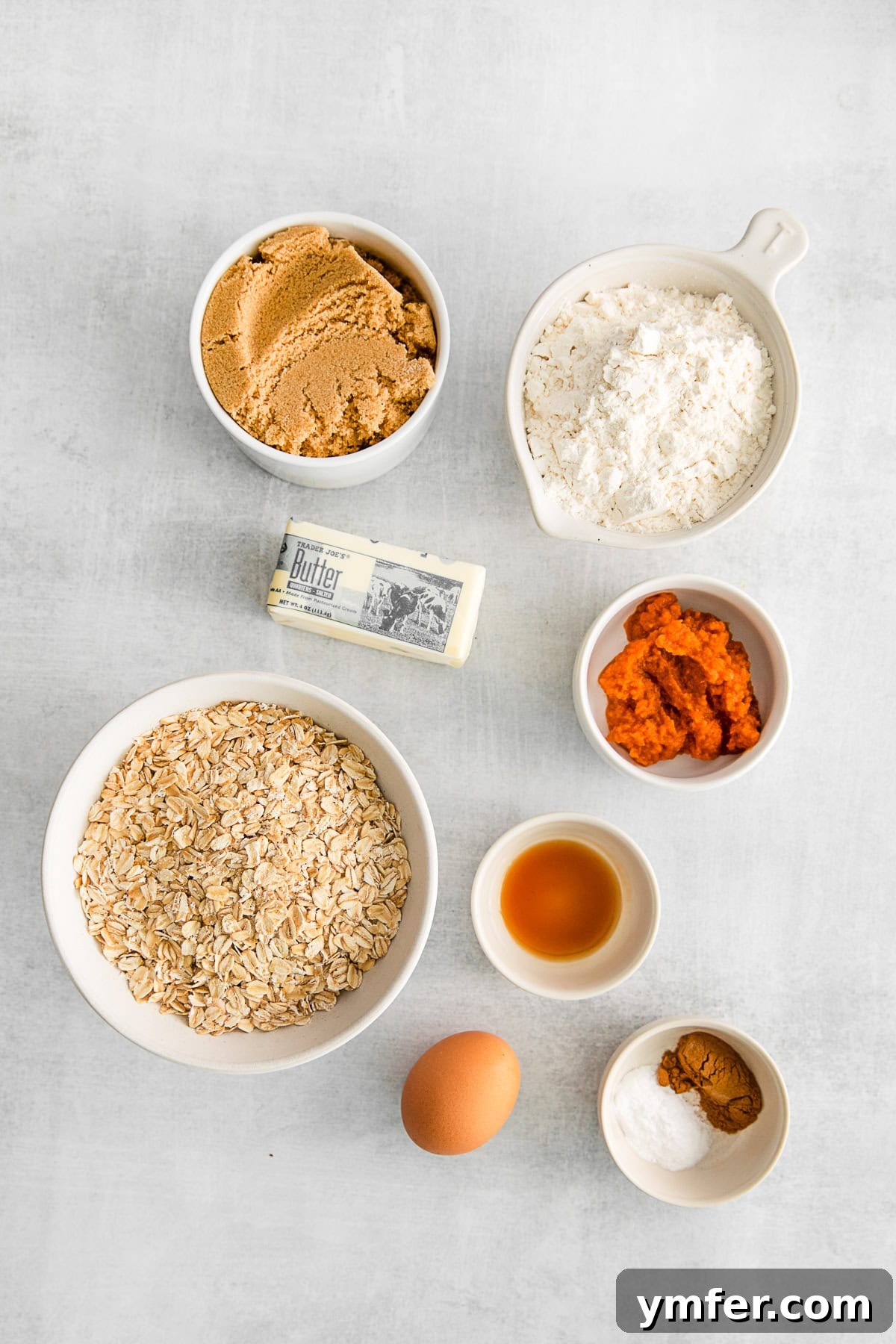 Autumn Spice Oatmeal Delights 3 Ingredients to make Pumpkin Oatmeal Cookies on a table.