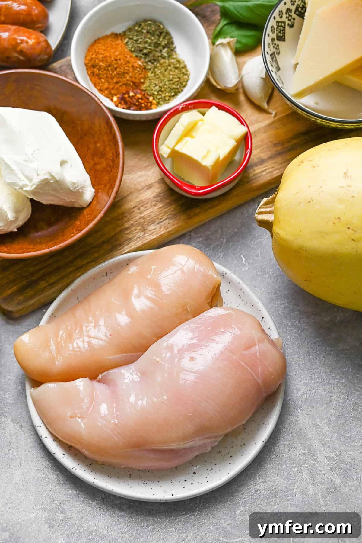 Zesty Cajun Chicken Alfredo on Spaghetti Squash Noodles 3 Ingredients to make Cajun Chicken Alfredo Spaghetti Squash on a table.