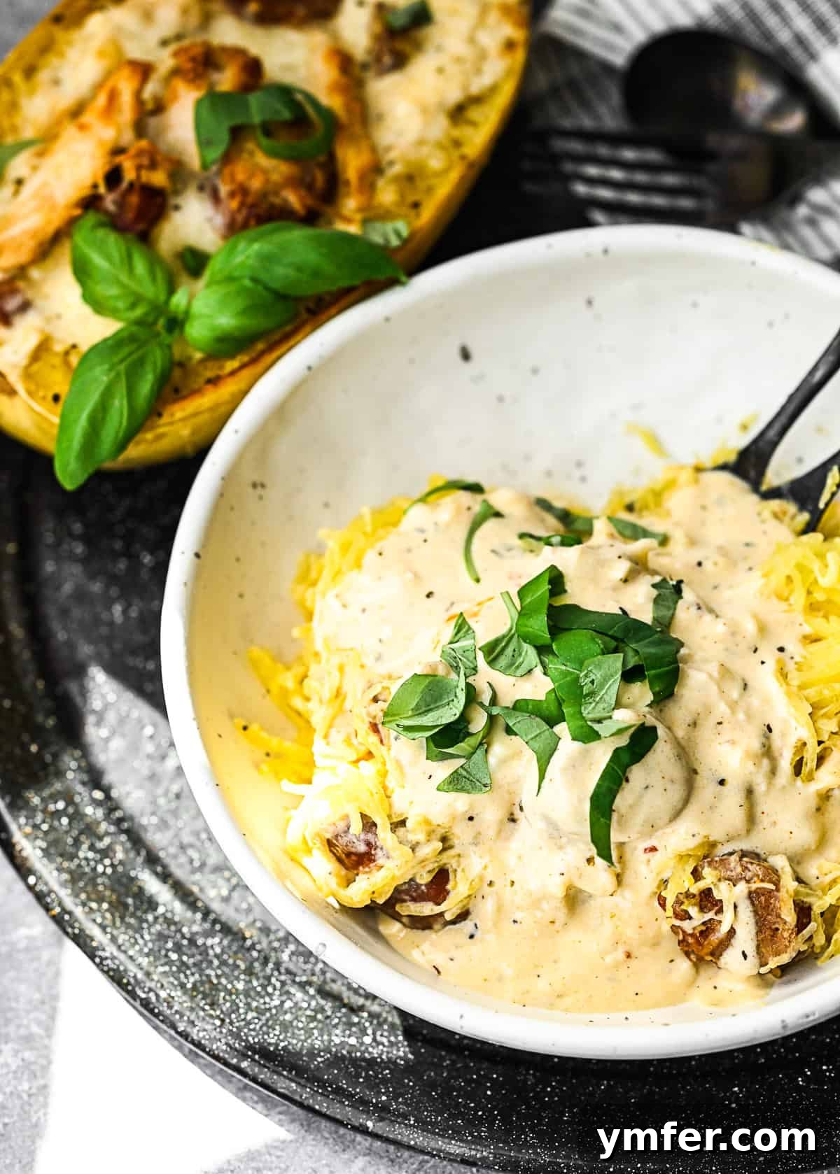 Zesty Cajun Chicken Alfredo on Spaghetti Squash Noodles 5 Cajun Chicken Alfredo Spaghetti Squash removed from the squash and put into a bowl.